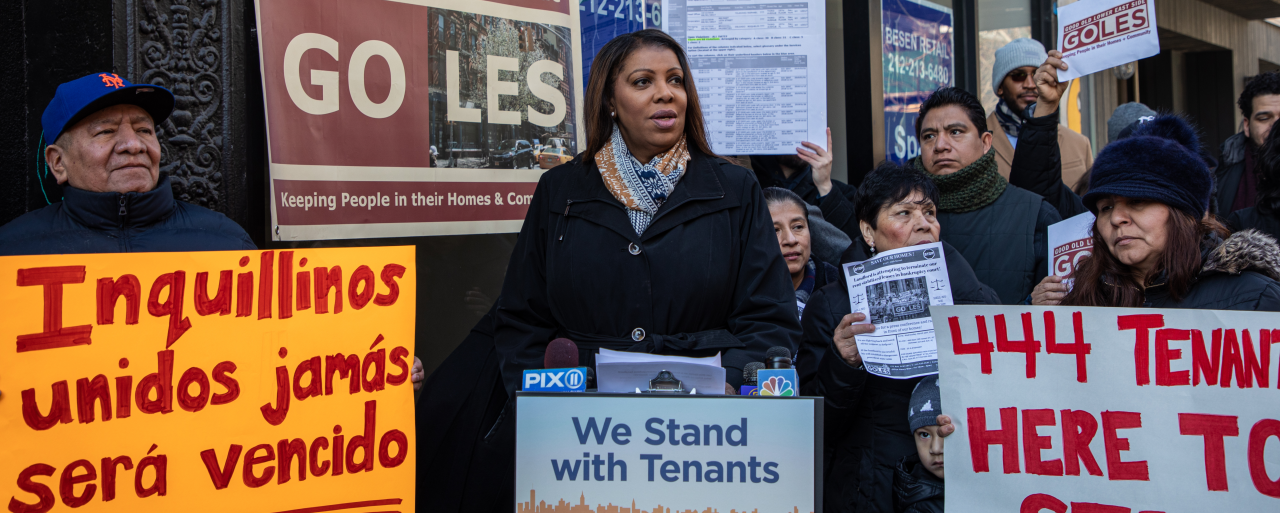 AG James at a podium that reads We Stand with Tenants